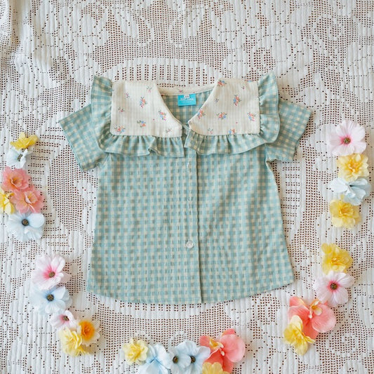 Camisa quadrados e flores